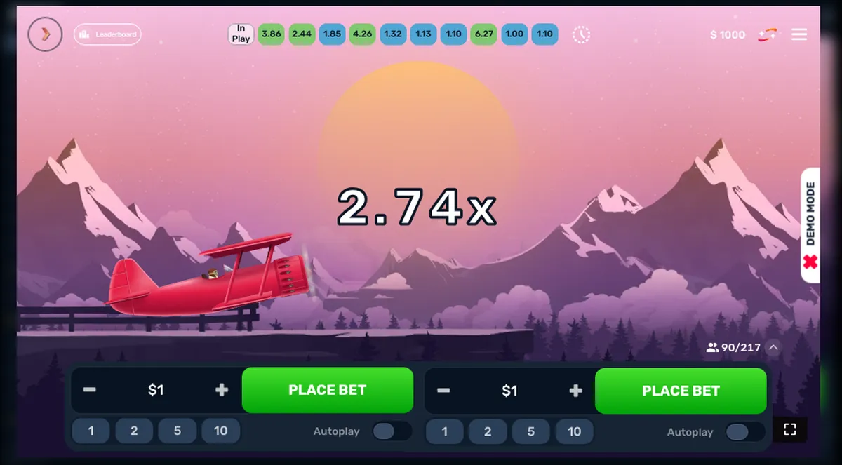 Captura do modo demo de Aero: biplano vermelho entre montanhas, multiplicador x2,74, indicação DEMO MODE e 90 de 217 jogadores conectados